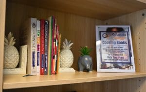 shows a book shelf with a selection of cookbooks and a notice to explain they are part of the free library