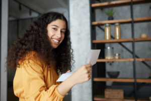 Student at Orlando Village reading and signing their student tenancy agreement with confidence.